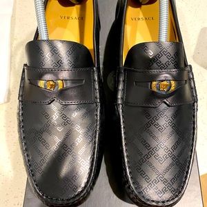 Worn once Versace black loafers gold coin
